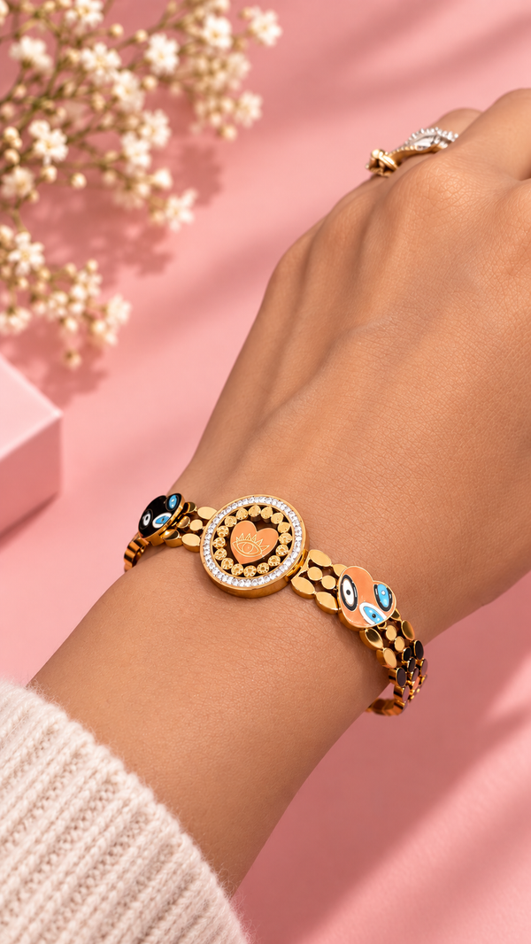 Gold-tone stainless steel evil eye bangle bracelet on wrist | Zohricanada