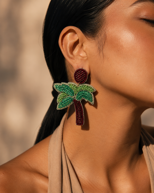 Handmade Tropical Palm Tree Beaded Statement Earrings for Women | Vacation & Resort Jewelry — Woman wearing handmade red and green beaded palm tree statement earring by ZOHRICANADA — Zohricanada