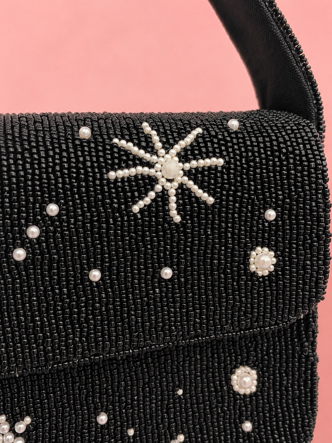Close-up of pearl starburst embellishment on the black beaded Midnight Celestial shoulder bag by ZOHRICANADA