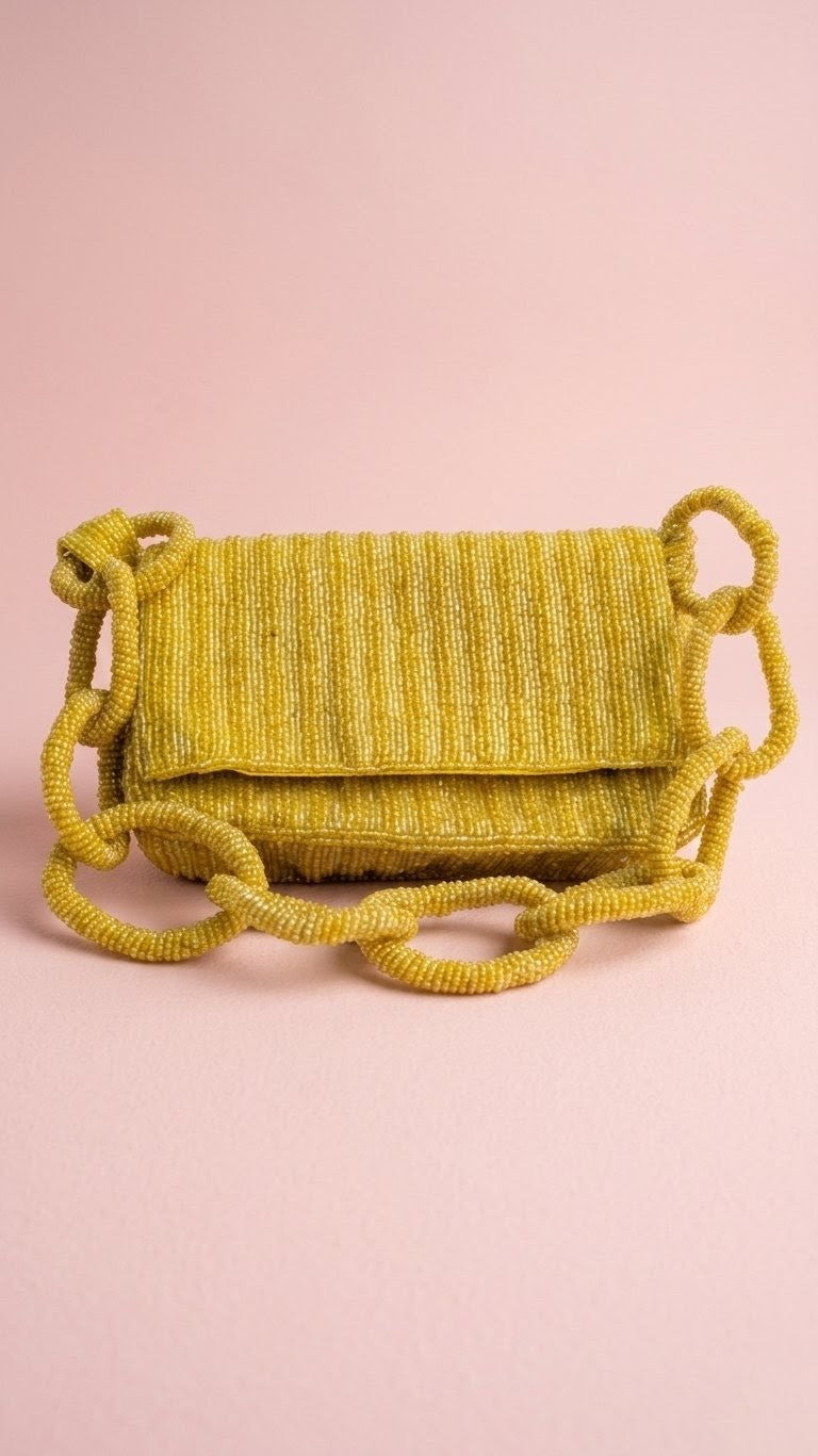 Golden Gate Beaded Bag — Yellow woven handbag with rope handles on a pink background — Zohricanada